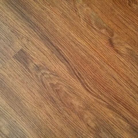 An aerial view of an indoor wood surface.
