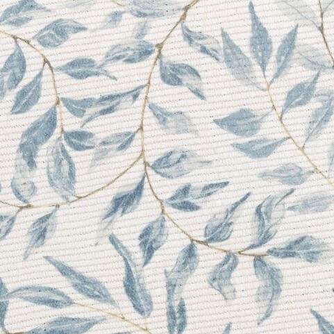 A closeup image of an indoor/outdoor polyester rug with a printed heritage floral design in soft neutral tones.