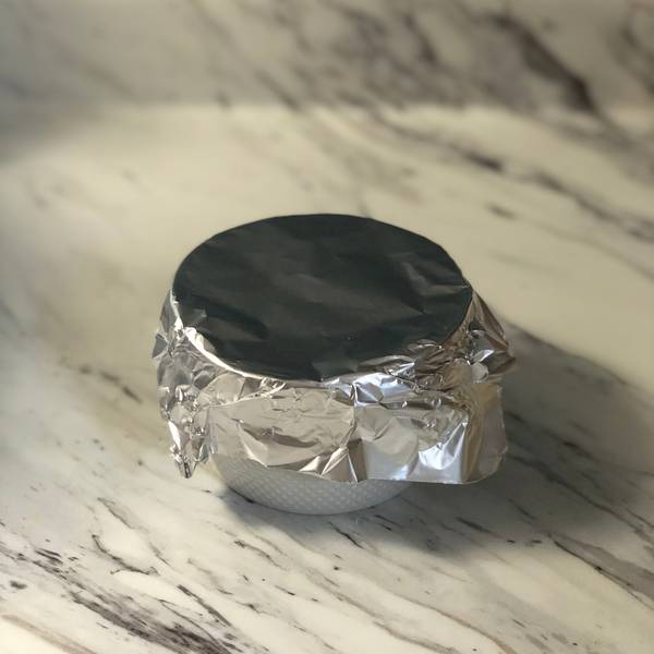 Covering the ramekins with foil