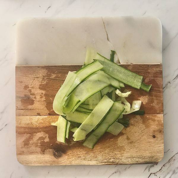 Thinly shaved cucumber slices