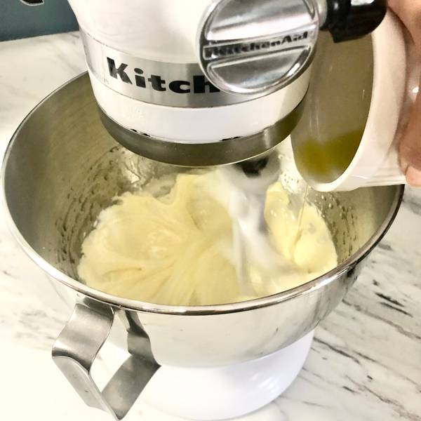 Adding olive oil into the batter