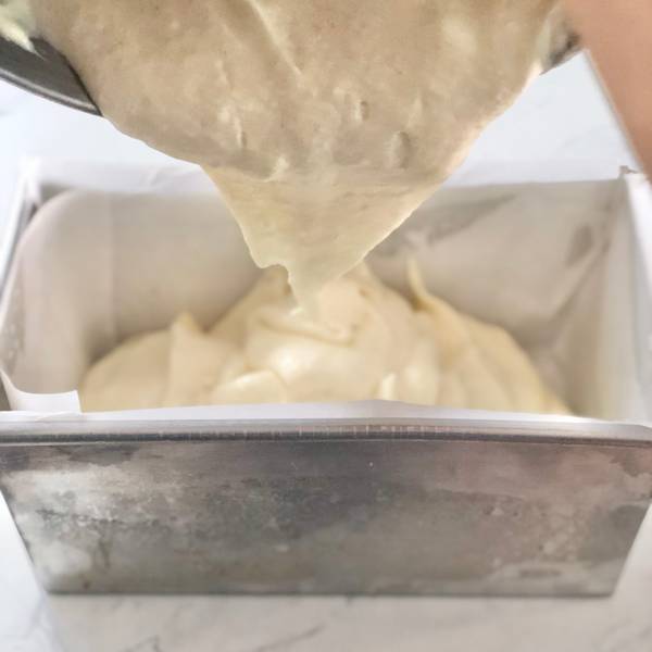 Pouring the cake batter into the loaf pan
