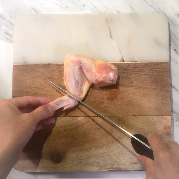 Separating the chicken tip from the chicken wing