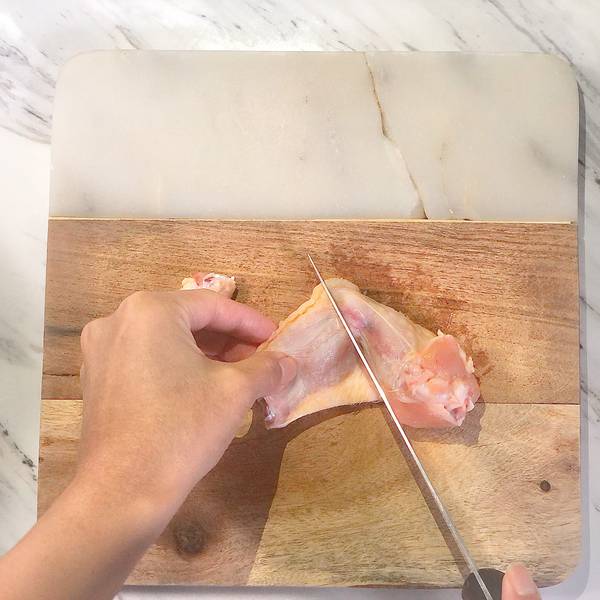 cutting the chicken wing in half