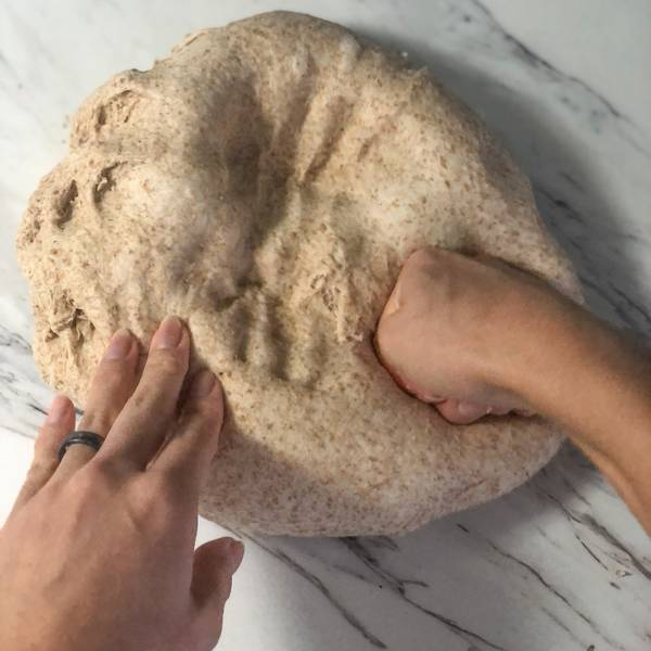 punching the air out of the dough