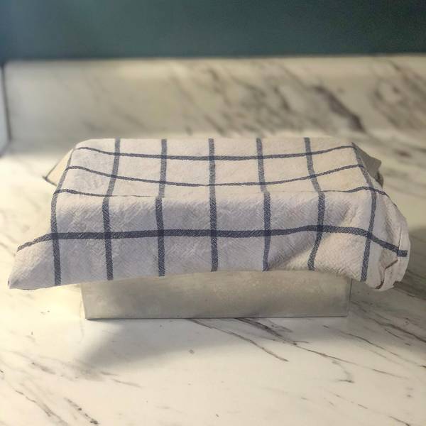 covering the loaf pan with a tea towel