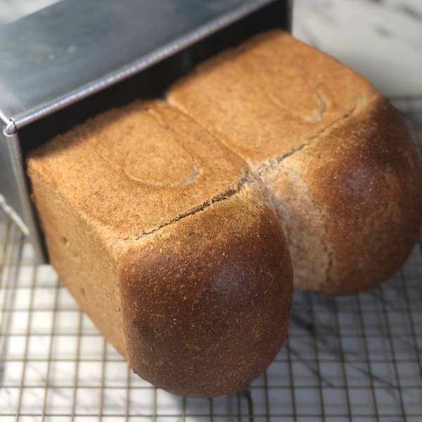taking the bread out of the pan