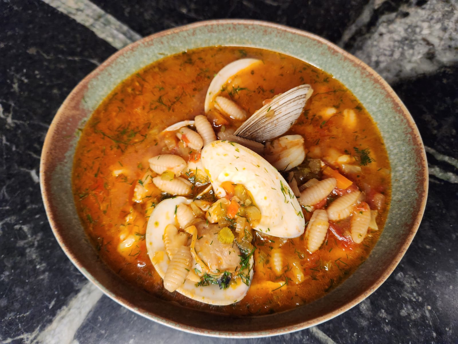 zuppa di pesce. Sardinian seafood soup. fresh pasta recipe. photo of soup. italian recipe. 