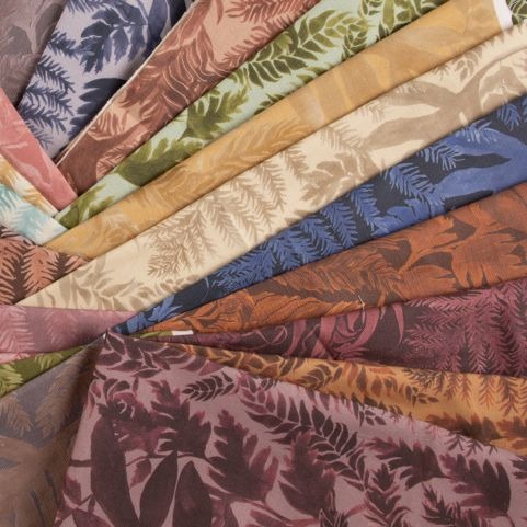 pile of fabric swatches in various prints and colours
