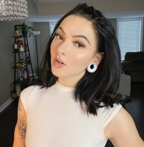 Girl wearing bright  Glass Opalite Saddle Plug / Gauge