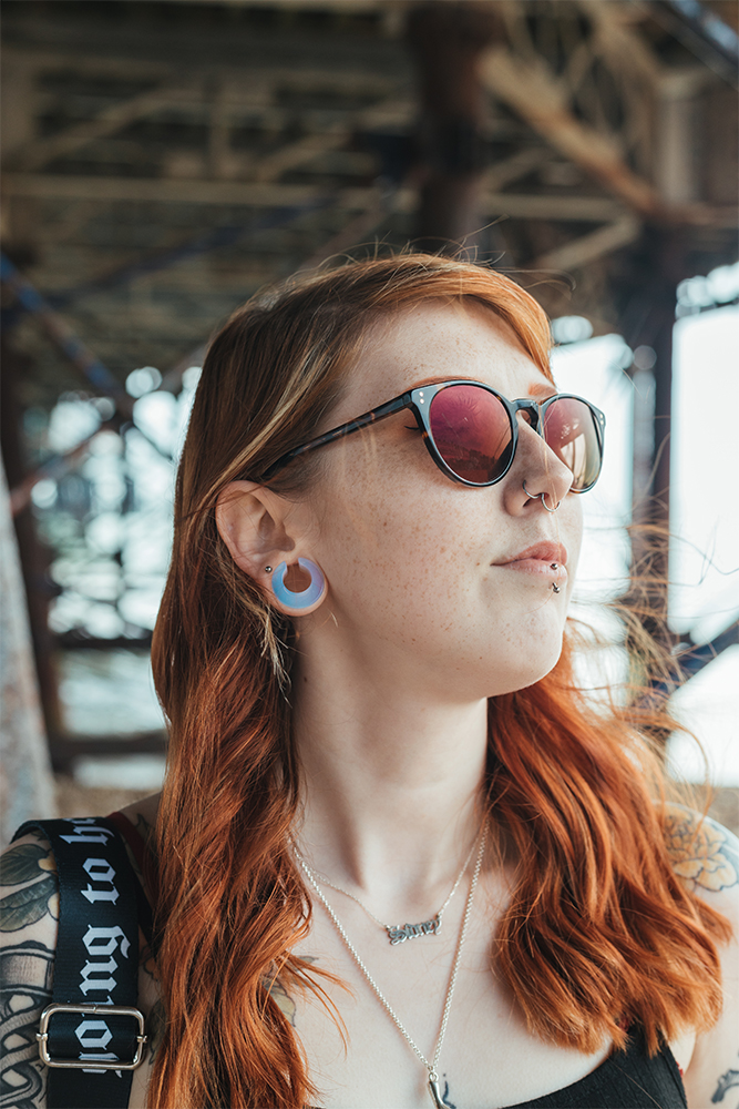 Girl wearing cute  Glass Opalite Saddle Plug / Gauge