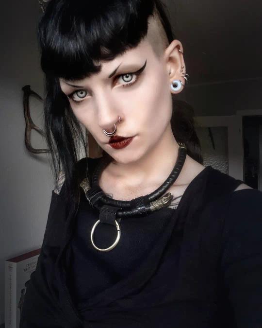 Girl wearing gothic  Glass Opalite Saddle Plug / Gauge