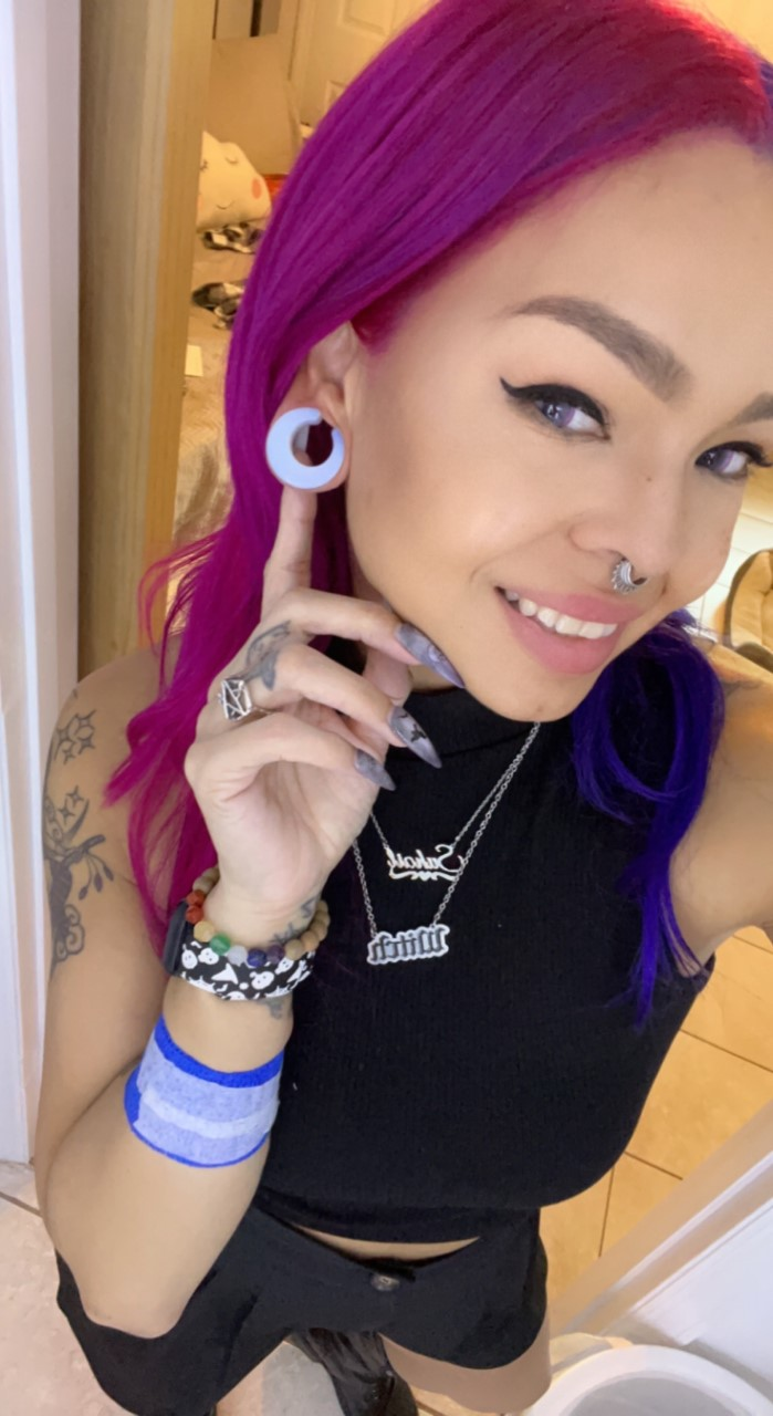 female wearing pretty  Glass Opalite Saddle Plug / Gauge