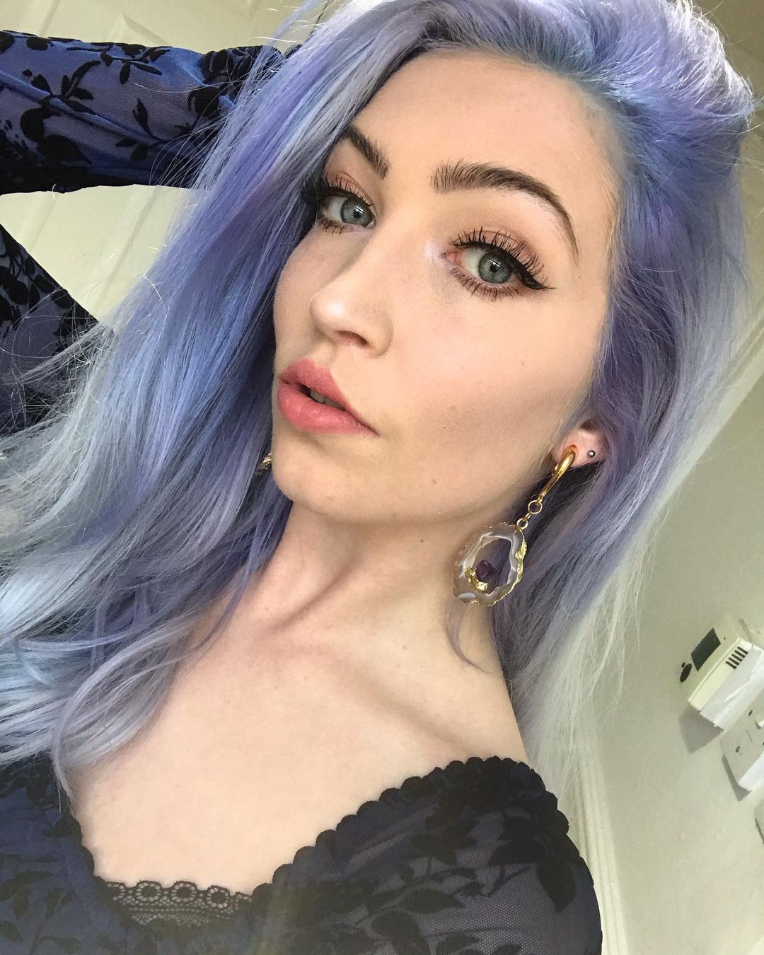 Women wearing terrific  Gold Hook Geode Slice Crystal Ear Weights (Pair)
