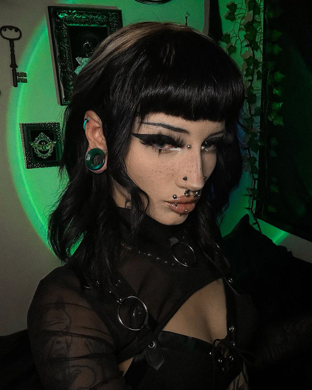Women wearing large Green Cats Eye Glass Ear Tunnel