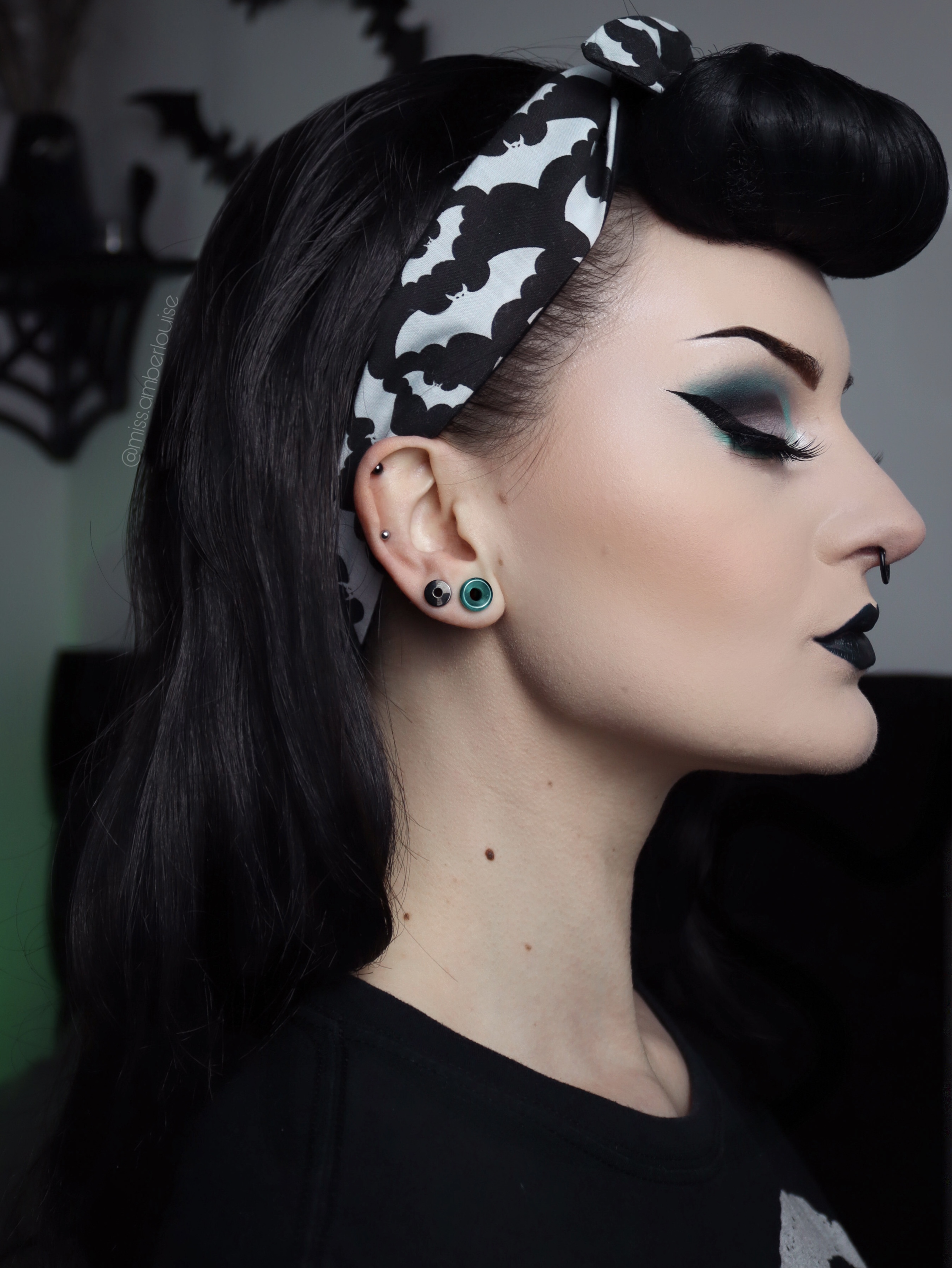 Girl wearing unique  Green Cats Eye Glass Ear Tunnel