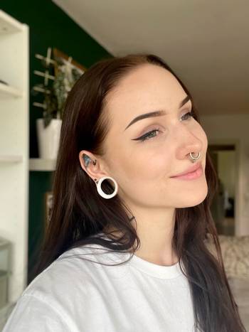 Girl wearing pretty White Eyelet Silicone Ear Tunnel