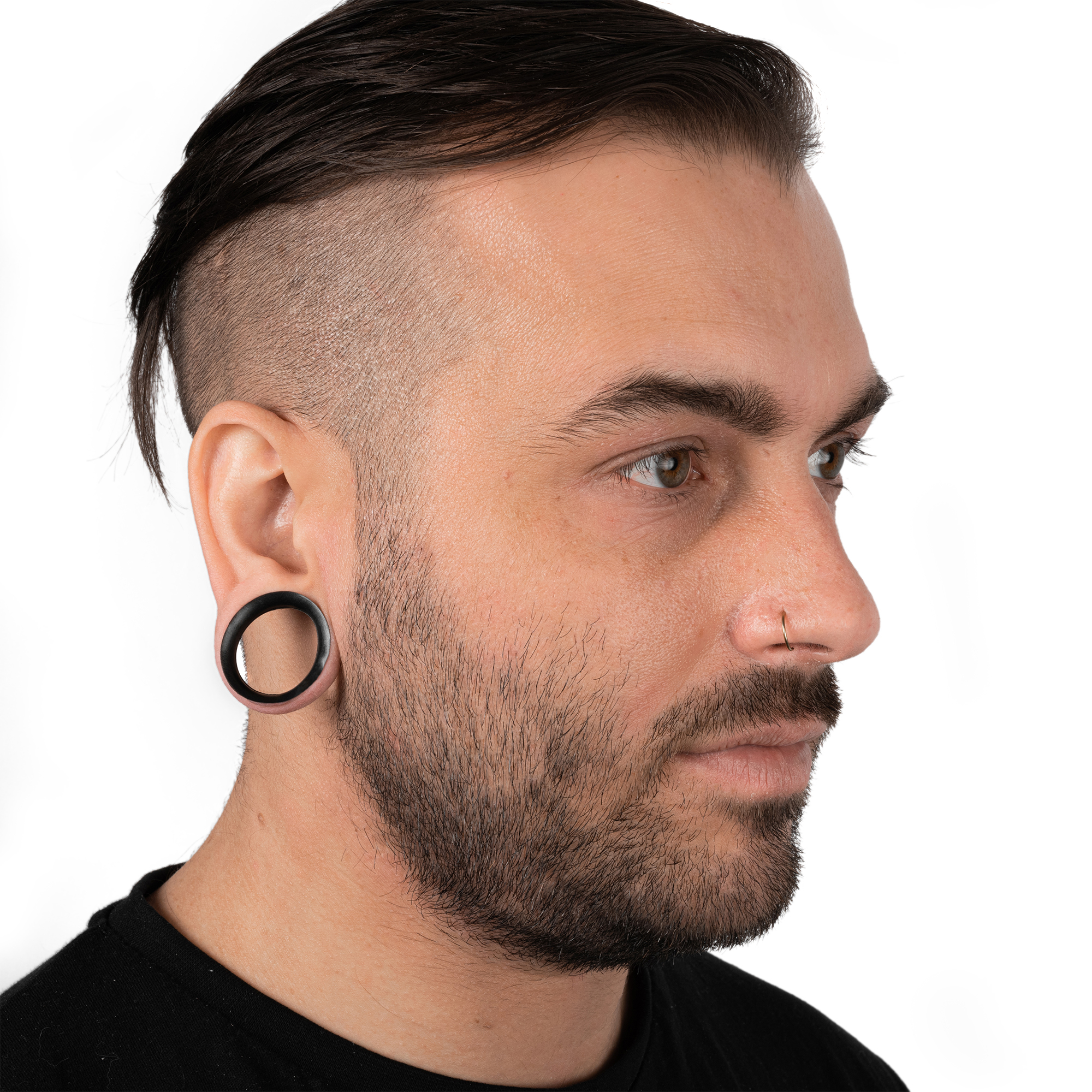 Male wearing large  Black Eyelet Silicone Ear Tunnel