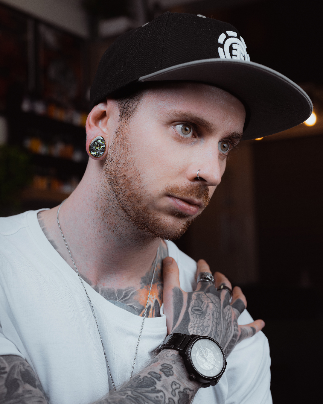 Guy wearing cool  Abalone & Gold Steel Teardrop Plug / Gauge