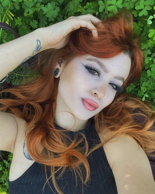 Girl wearing pretty  Abalone & Gold Steel Teardrop Plug / Gauge