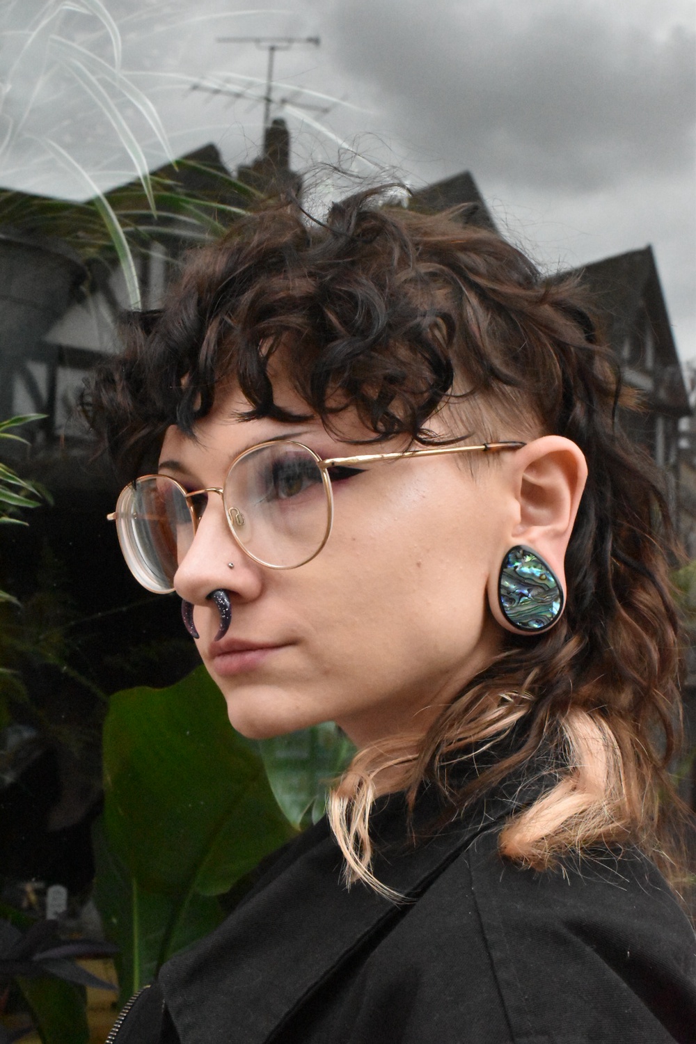 Girl wearing large  Abalone & Black Steel Teardrop Plug / Gauge