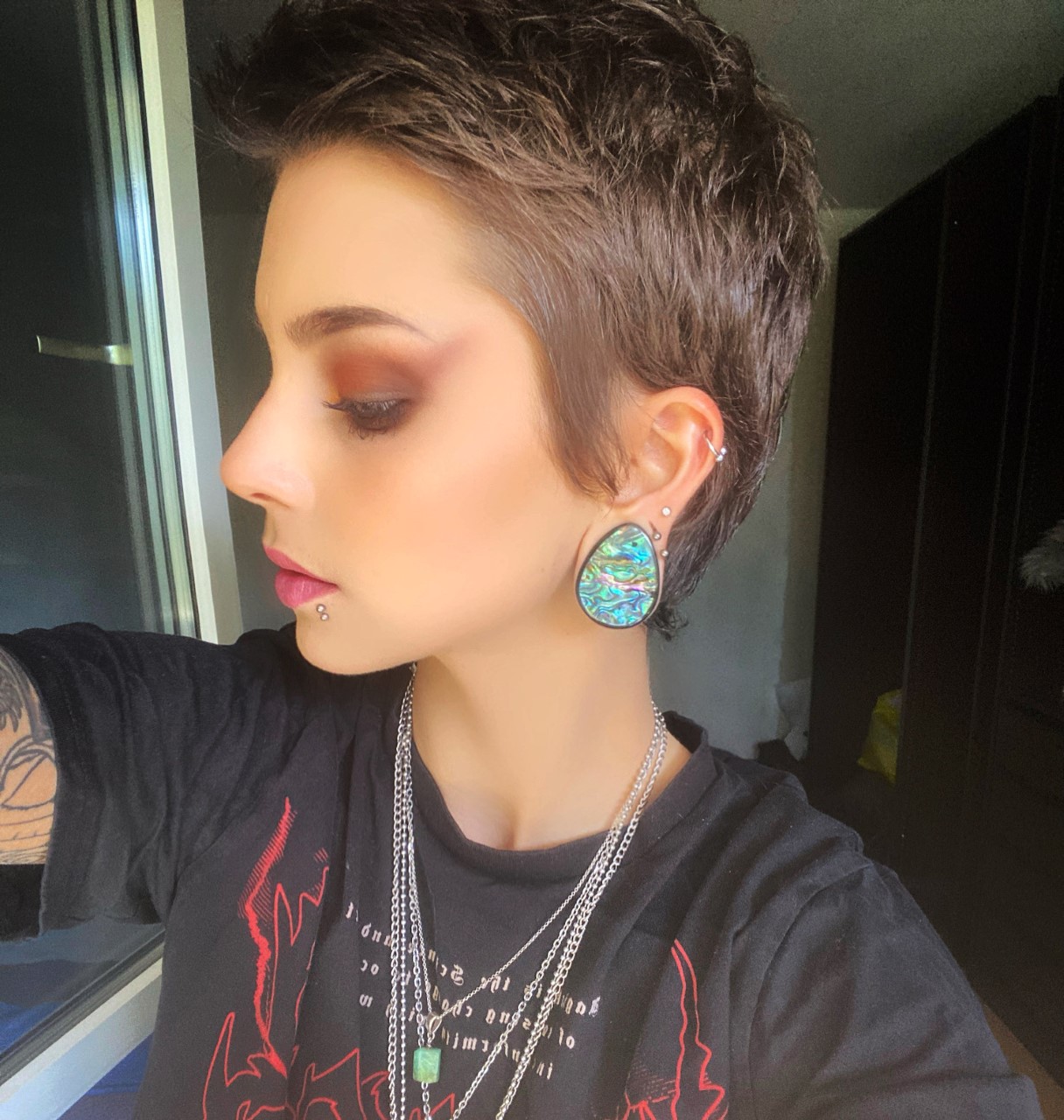 Girl wearing fantastic  Abalone & Black Steel Teardrop Plug / Gauge