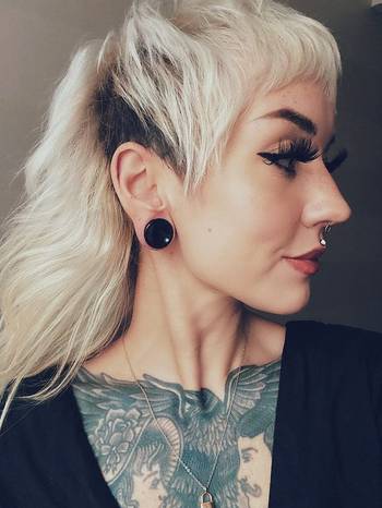 Girl wearing pretty Black Cats Eye Glass Plug / Gauge