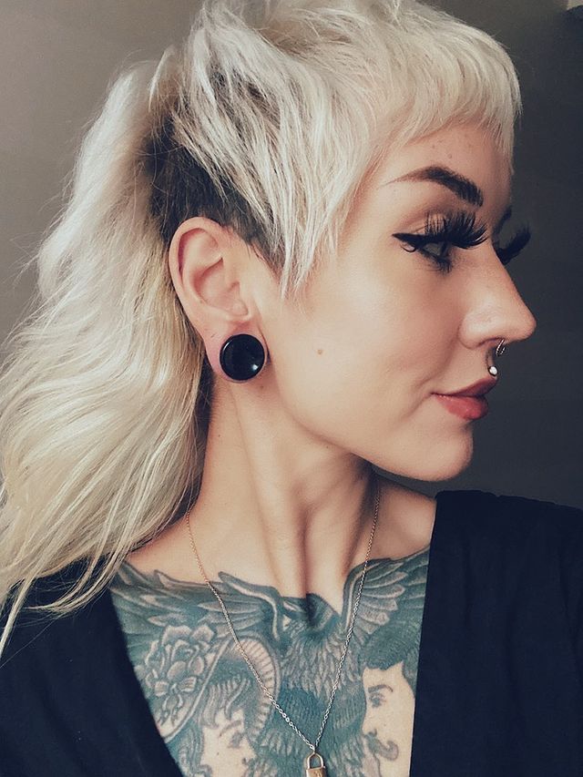 Girl wearing pretty Black Cats Eye Glass Plug / Gauge