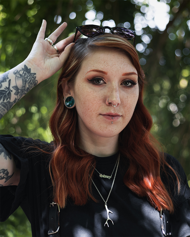 Girl wearing big  Green Cats Eye Glass Plug Stretched Ears Jewellery / Gauge
