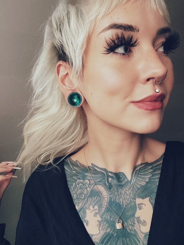 Girl wearing cool  Green Cats Eye Glass Plug Stretched Ears Jewellery / Gauge