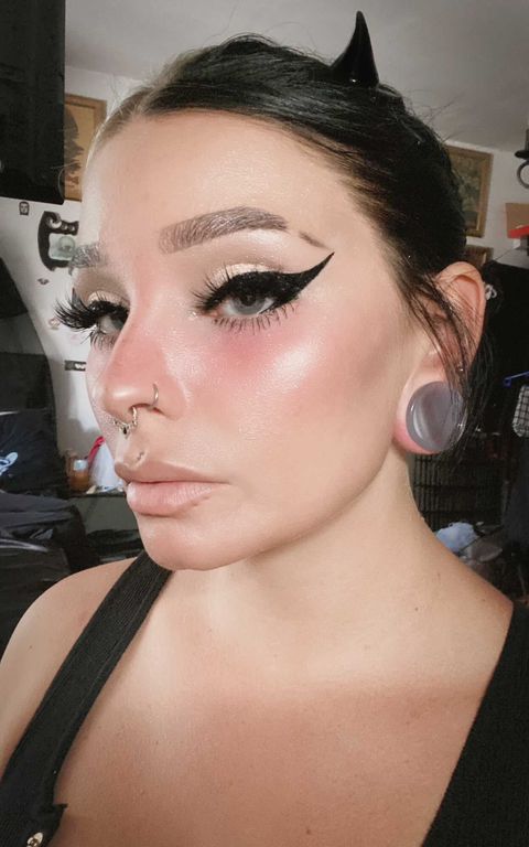 Female wearing large  Grey Cats Eye Glass Plug / Gauge