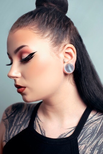 Female wearing pretty  Grey Cats Eye Glass Plug / Gauge