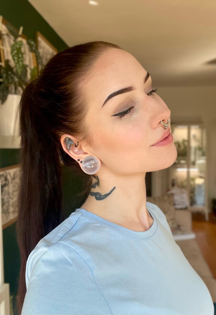 Female wearing big  Grey Cats Eye Glass Plug / Gauge