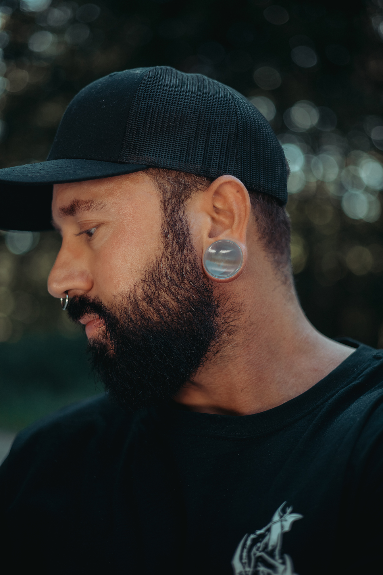 Alternative Tattooed man wearing Grey Cats Eye Glass Plug / Gauge