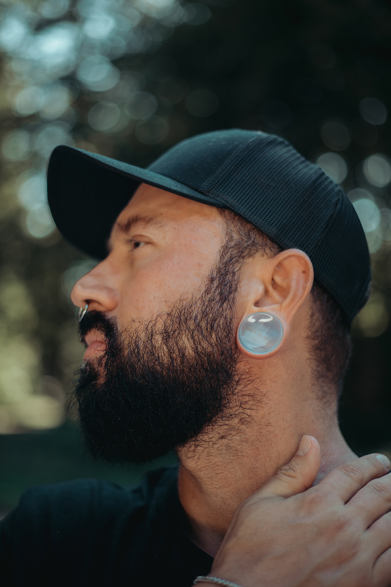 Man wearing cool  Grey Cats Eye Glass Plug / Gauge
