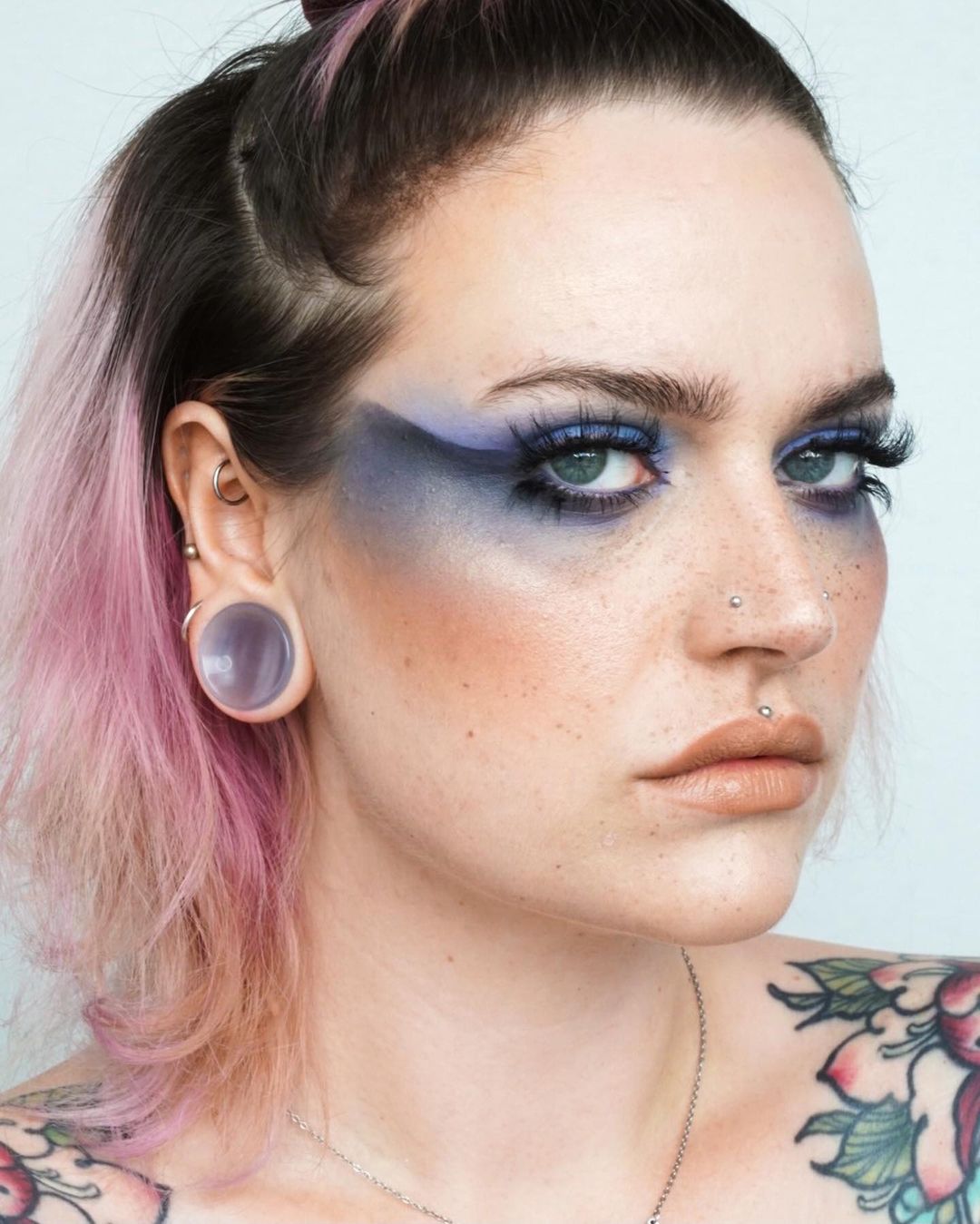 Female wearing cool  Grey Cats Eye Glass Plug / Gauge