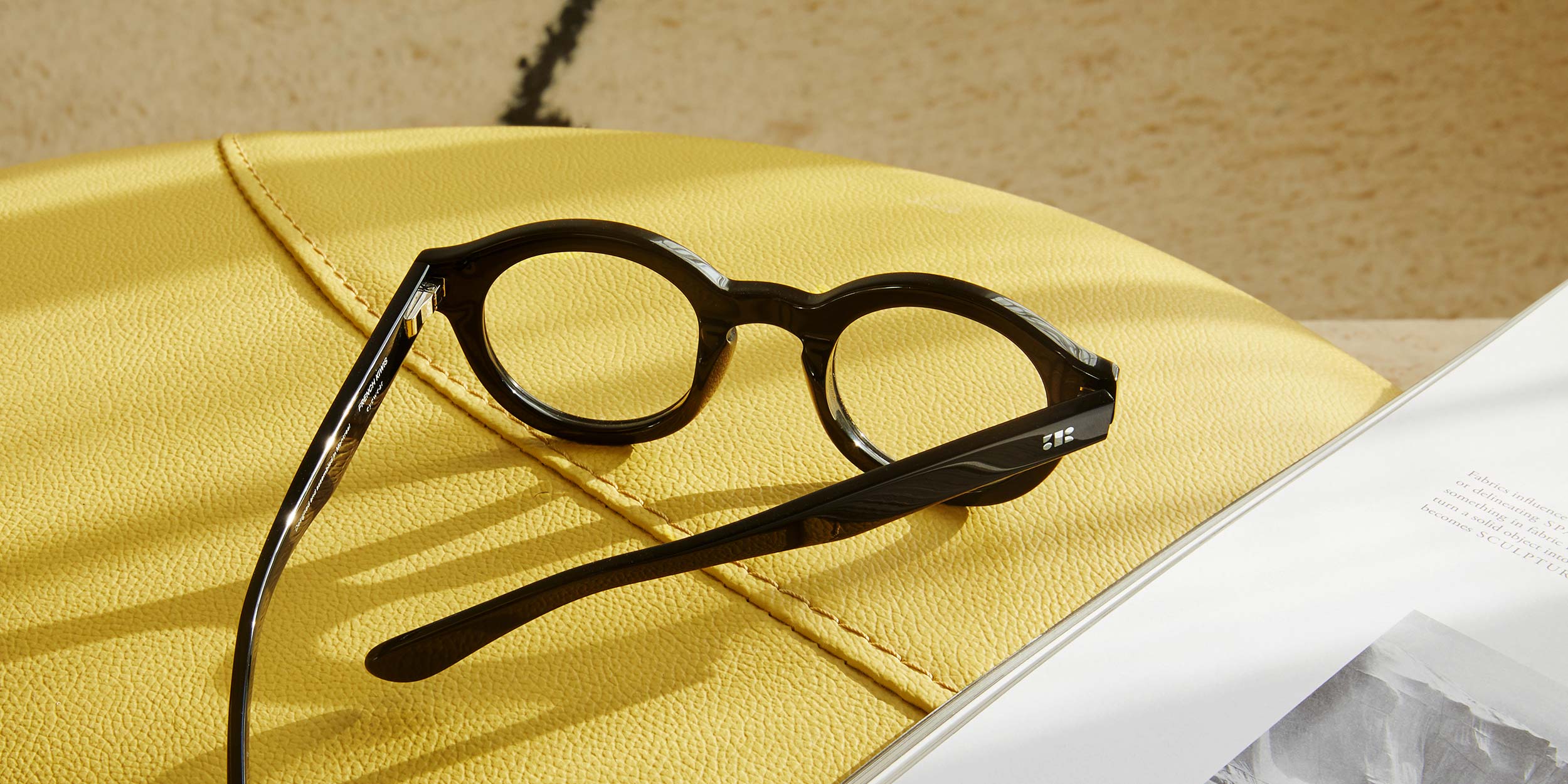 Photo Details of Eden Cognac Reading Glasses in a room