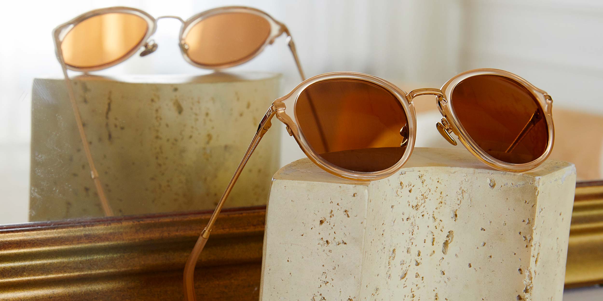 Photo Details of Morgan Sun Apricot & Gold Sun Glasses in a room