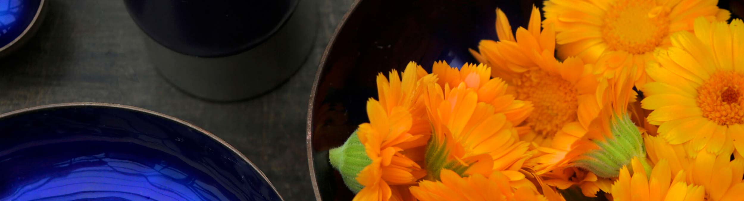 Calendula flowers cut and in a bowl on a table