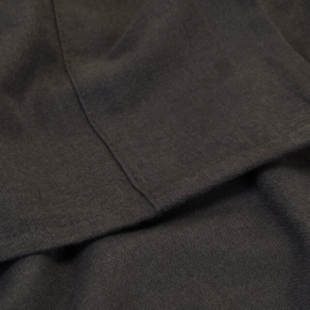 A detailed view of the materials and stitching on the Slumber Cloud Flannel Sheet Set in smoke