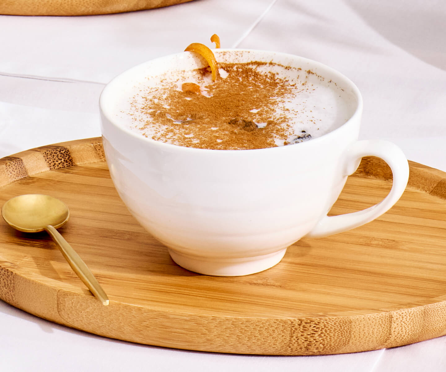 Citrus Earl Grey Latte in a Cafe Cup on a an Oval Tray