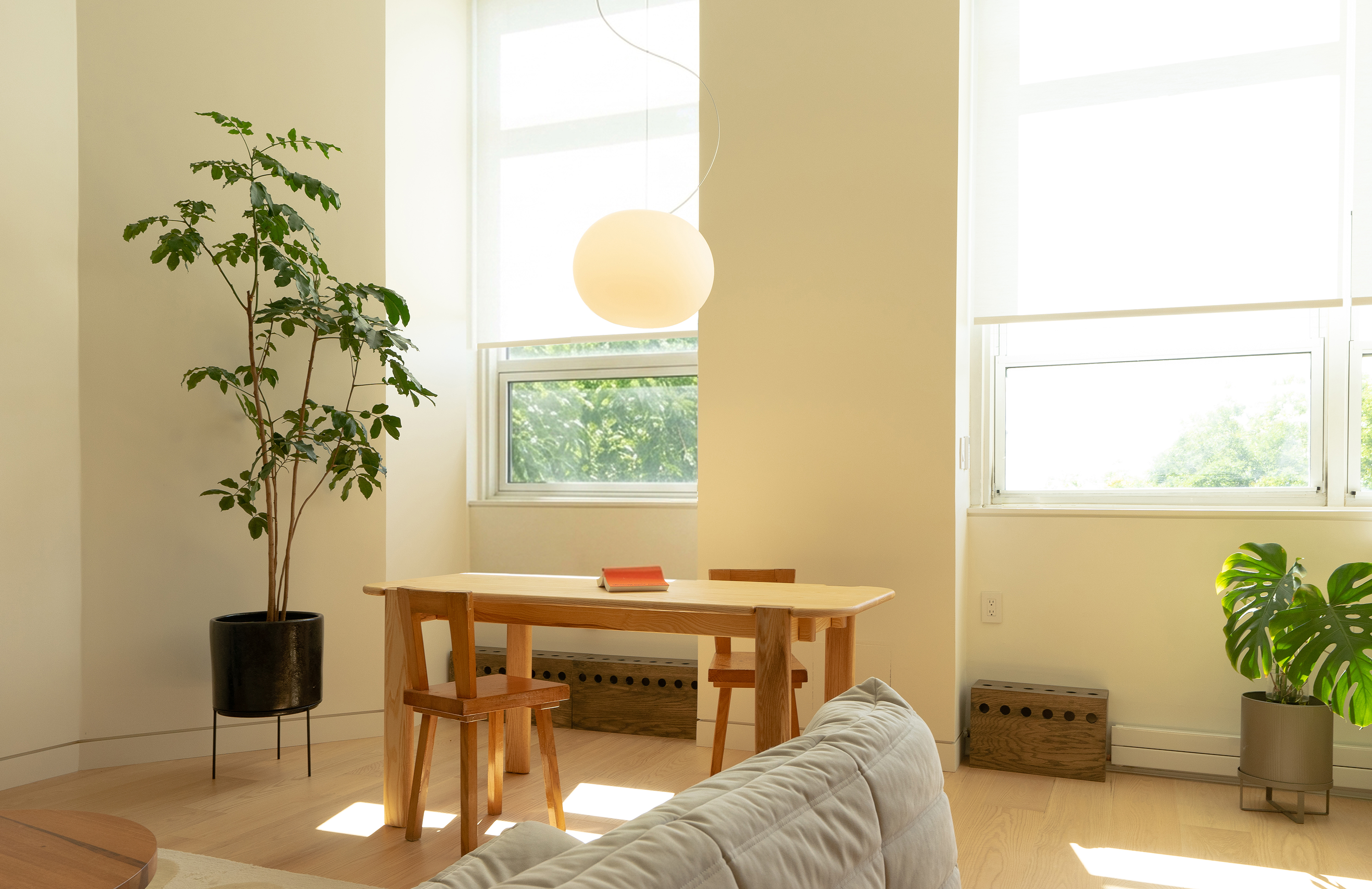 Hardwood floors connecting the kitchen and living area in a Carroll Gardens home