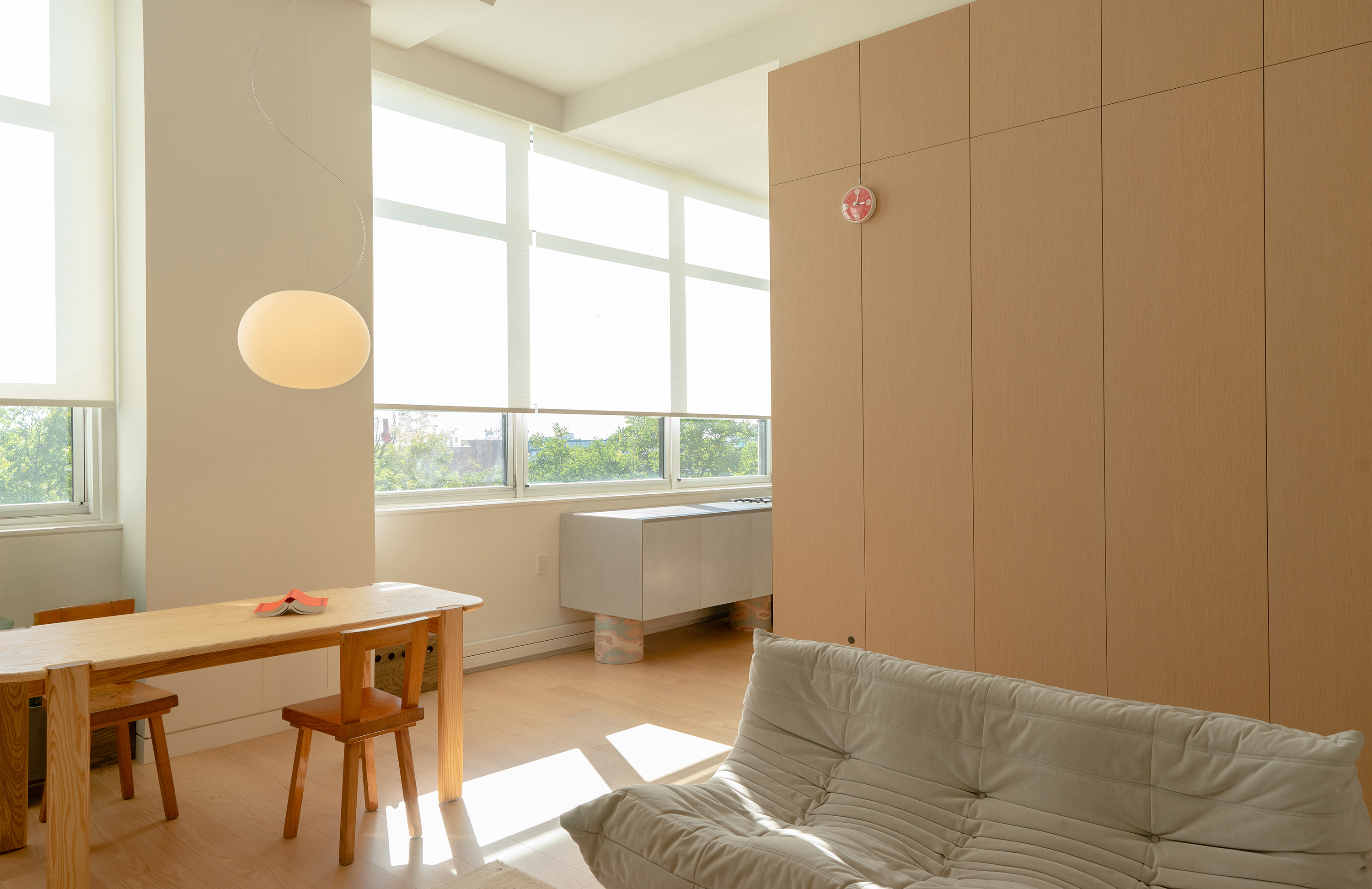 Hardwood floors connecting the kitchen and living area in a Carroll Gardens home