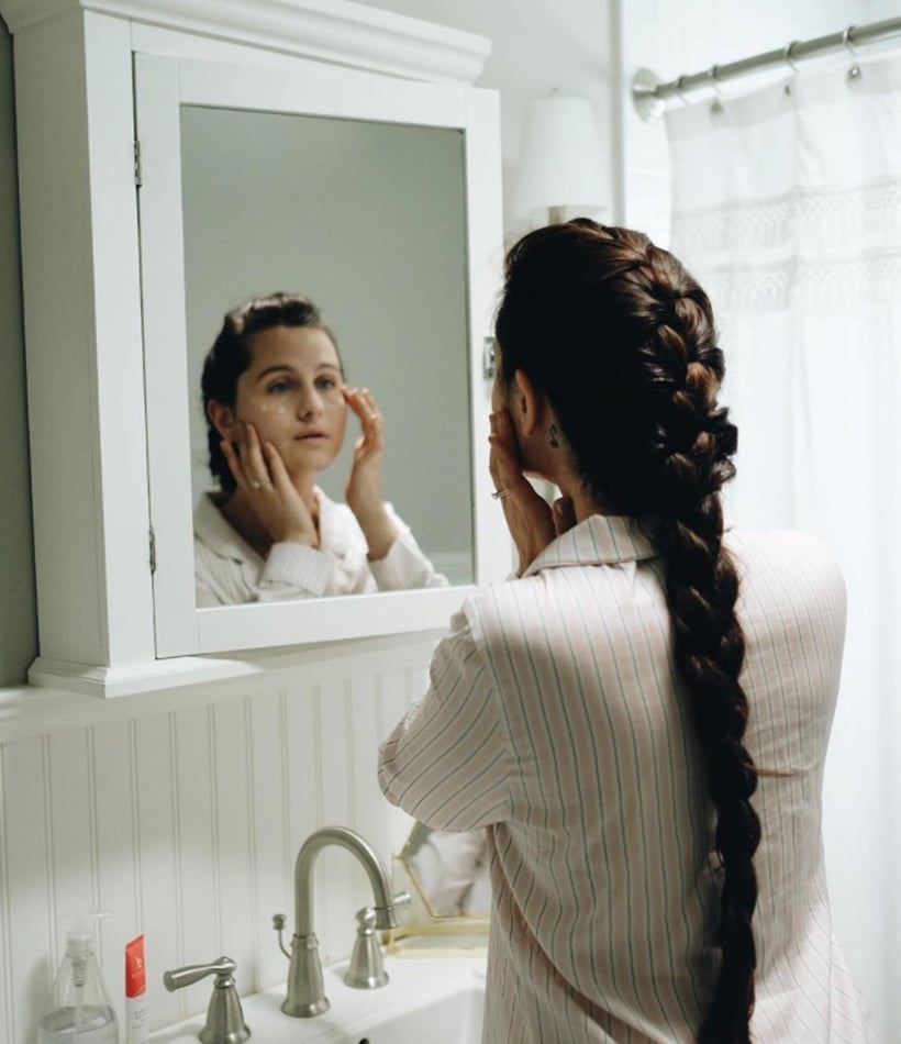 Woman using facial cream