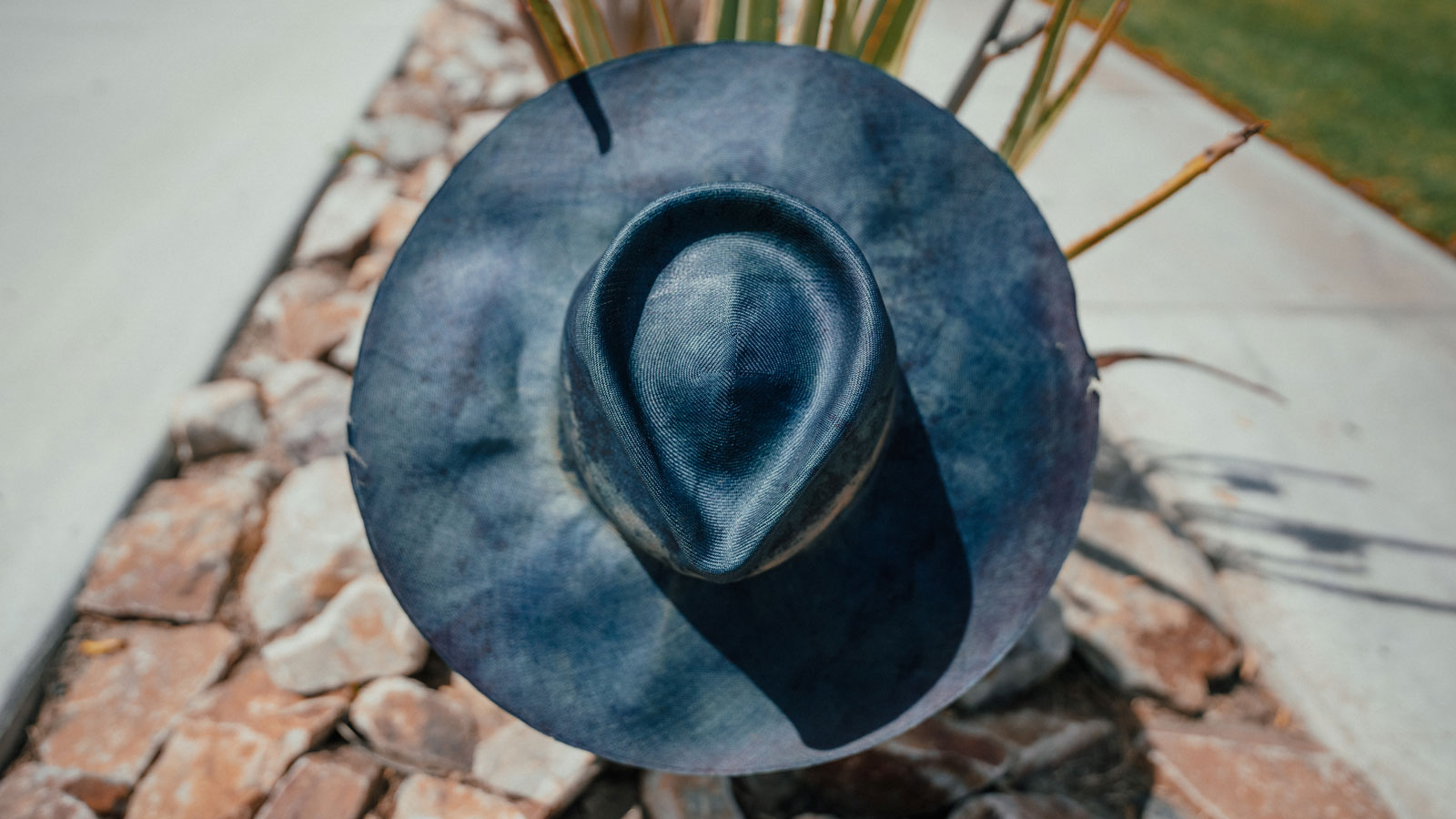 Design
Triple Indigo Hand-dyed Bacu straw. An exquisite organic piece inspired by the sediment of the earth.
Material
Triple Indigo hand-dyed Bacu straw. Natural dyeing minimizes the harmful effects on the surrounding environment. Our custom hats are hand-dyed by using plant and vegetable-based pigments.
Specifications
No two pieces are exactly alike, making each work one of a kind. Due to the nature of our products and their process, some variance and character is to be expected. Handmade in our atelier in NYC. Please allow 2-4 weeks to custom make this special piece.