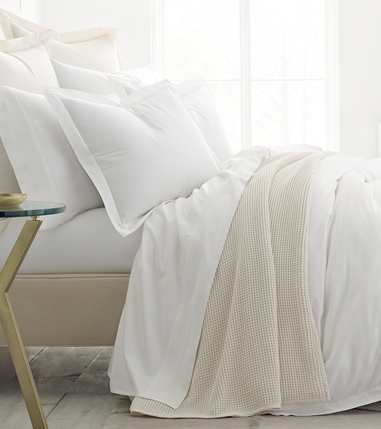 Side profile bed with white sheets