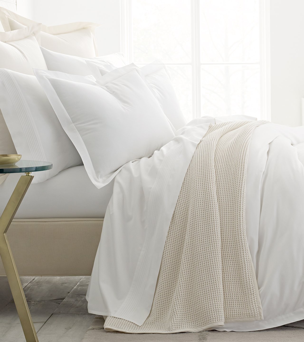 Side profile bed with white sheets