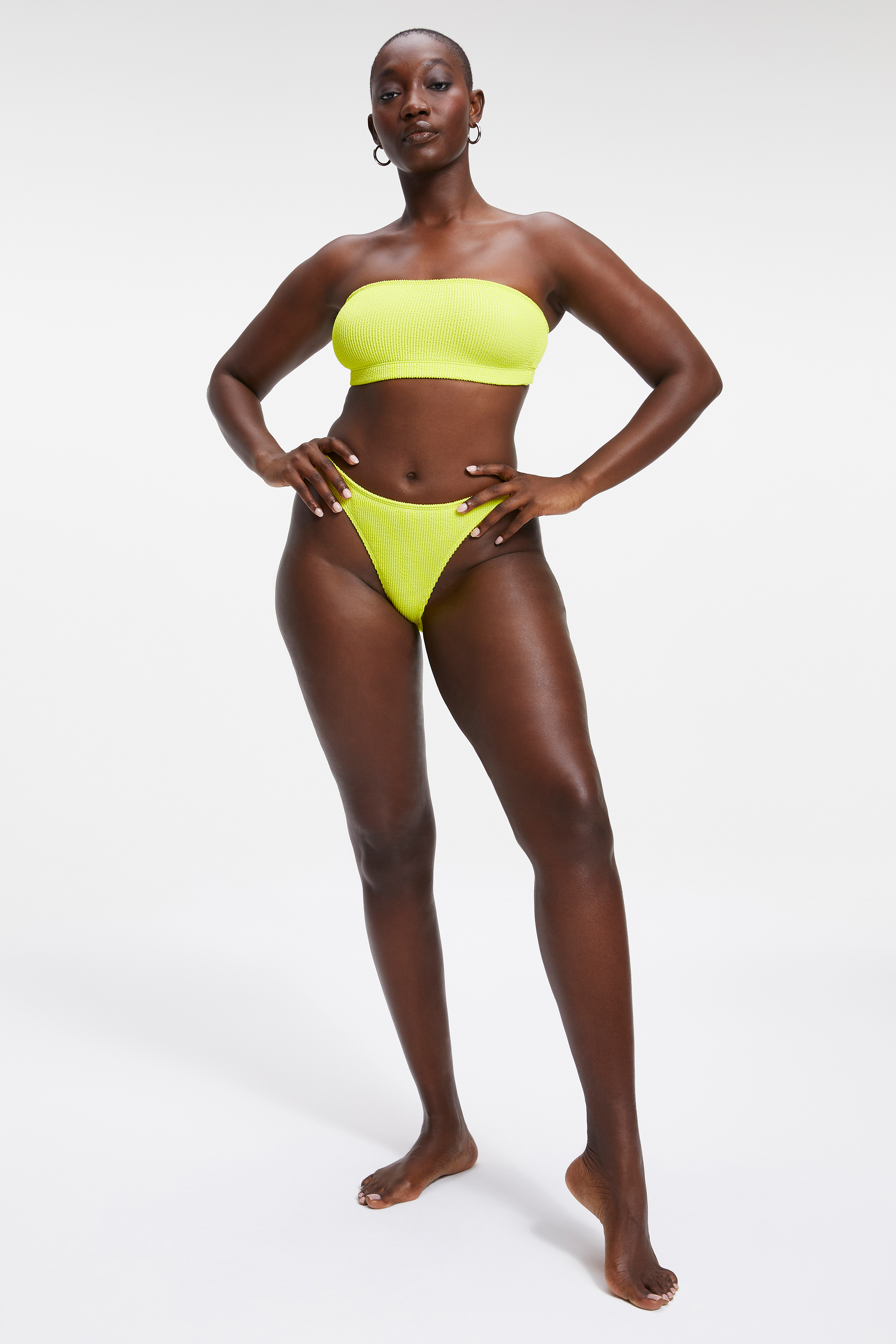 ALWAYS FITS BETTER CHEEKY in ELECTRIC YELLOW001 styled with our ALWAYS FITS BETTER BAND TOP in ELECTRIC YELLOW001, ALWAYS FITS MINI SKIRT in ELECTRIC YELLOW001, or ALWAYS FITS ONE SHOULDER TOP in ELECTRIC YELLOW001
