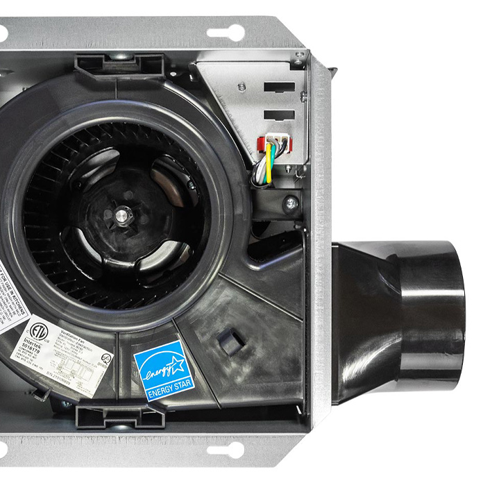 View of the bath fan motor and blower wheel beneath the grille.