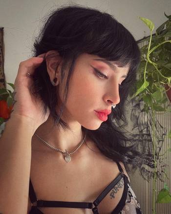 Girl wearing cute Ring Stack for Stretched Ears, Silver, Titanium, Small - 10 Rings